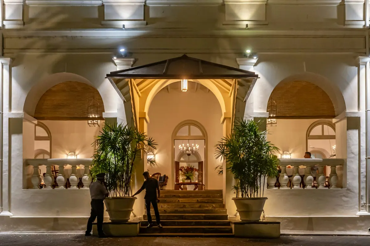 A warmly lit building entrance in the evening